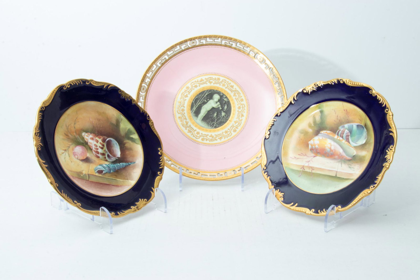 HAND PAINTED "SEASHELL" PLATES (2) DIA 8", + MINTON PATE SUR PATE PLATE (AS IS): HAND PAINTED "SEASHELL" PLATES (2) DIA 8", + MINTON PATE SUR PATE PLATE (AS IS) Two plates circa 1900 with still life sea shell scenes. Dia 8". Good condition. Also a Minton pate sur pate plate by T. 