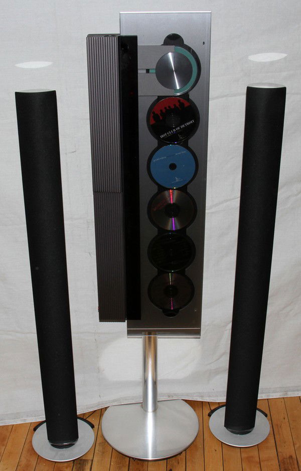 BANG & OLUFSEN STEREO SYSTEM, 3 PIECES,: BANG & OLUFSEN STEREO SYSTEM, THREE PIECES, H 432" & 51":Includes a disc changer, two speakers and a remote control.