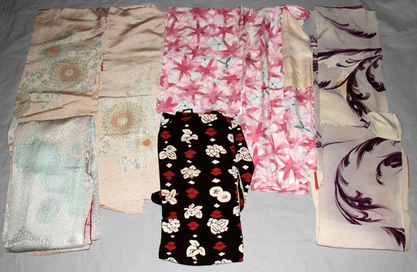 JAPANESE KIMONOS, 20TH C, 5 PCS.: JAPANESE KIMONOS, 20TH C, 5 PCS.:having violet floral designs, white and green floral, black with white and red diamond and floral patterns, white, pink and blue floral, blue petals and white with sma