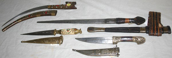 PERSIAN AND AFRICAN DAGGERS, 4 PCS.: PERSIAN AND AFRICAN DAGGERS, 4 PCS.:includes one Palestinian, one Syrian, one East Indian and one African dagger; the Palestinian dagger has a engraved double edged 5 3/4" straight blade, bone hilt wi