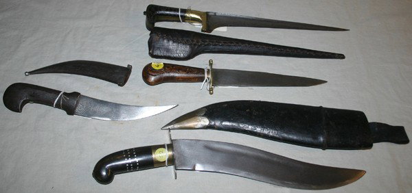 EAST INDIAN AND NEPALESE DAGGERS, 4 PCS., : EAST INDIAN AND NEPALESE DAGGERS, 4 PCS., L 6" - 11" BLADES:includes one Indian Kyber dagger with a t-shape engraved straight blade, 10 1/2" L. with carved wood handle with dot form inlays and gilt br
