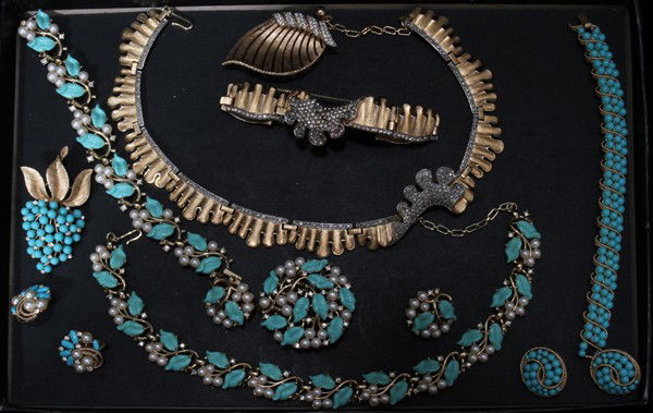 TRIFARI COSTUME JEWELRY COLLECTION, 14 PIECES: TRIFARI COSTUME JEWELRY COLLECTION, FOURTEEN PIECES:One ensemble includes a gold tone necklace, bracelet and brooch enhanced with rhinestones; a faux coral grouping that includes a bracelet, clip earr