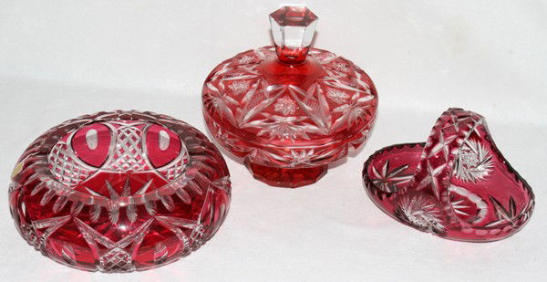 CRANBERRY CUT-TO-CLEAR CRYSTAL TABLE WARE 3 PCS: CRANBERRY CUT-TO-CLEAR CRYSTAL TABLE WARE, THREE PIECES, H 3"-7":Including 1 ashtray, Dia.8", 1 covered dish, H.7", and 1 basket, H.3".