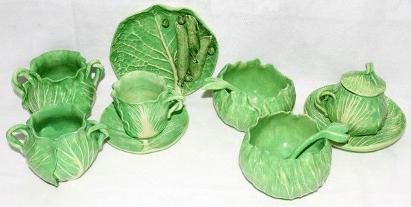 DODIE THAYER LETTUCE LEAF POTTERY WARE, 11 PCS: DODIE THAYER LETTUCE LEAF POTTERY WARE, ELEVEN PIECES:Including 2 sauce dishes with 2 ladles, 1 condiment pot with 1 under plate, 1 cup with 1 sauce, 2 sugar bowls, and 1 plate with peas. Lettuce leaf