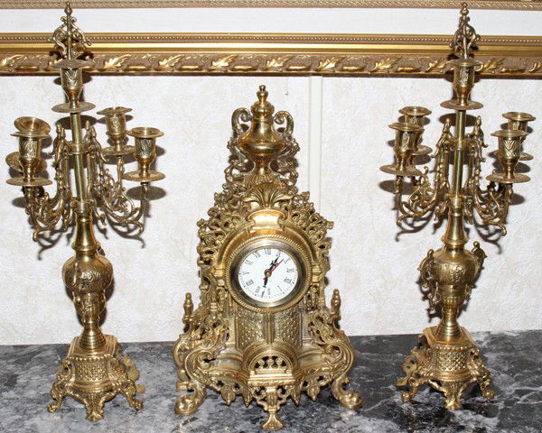 BRASS CLOCK & CANDELABRA GARNITURE SET, 3 PIECE: ROCOCO STYLE BRASS CLOCK & CANDELABRA GARNITURE SET, THREE PIECES:Including a mantel clock and pair of five-light candelabra.