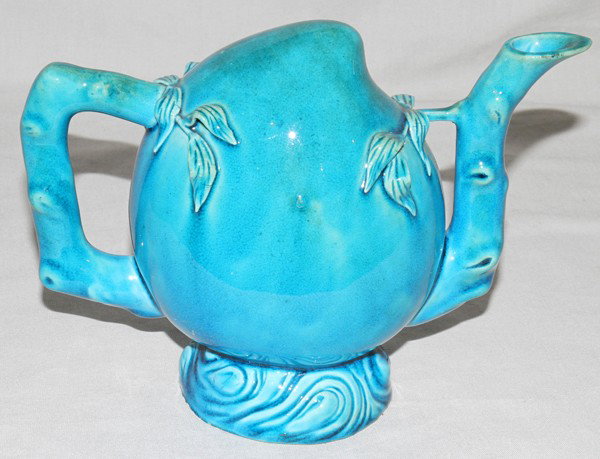 CHINESE CERAMIC 'PUZZLE' TEAPOT, H 6 1/4", : CHINESE CERAMIC 'PUZZLE' TEAPOT, H 6 1/4", L 8 1/4":Teal in color with a vine design.