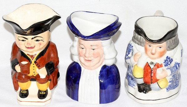 ENGLISH IRONSTONE CHARACTER PITCHERS, THREE, : ENGLISH IRONSTONE CHARACTER PITCHERS, THREE, H 5 1/2" - 6 1/2":Hand painted.