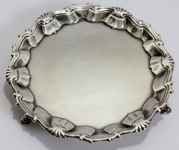 ENGLISH STERLING SILVER POSSIBLY BY HENRY BRIND: ENGLISH STERLING SALVER, POSSIBLY BY HENRY BRIND, MID 18TH CENTURY, H 1", DIA 7":Stamped on the underside with "H.B" enclosed within a rectangle, a lion passant, the somewhat worn date letter p (appea