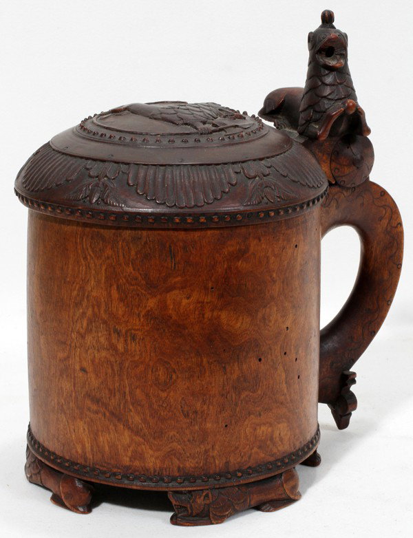 SCANDINAVIAN BURL WOOD PEG TANKARD/STEIN, : SCANDINAVIAN BURL WOOD PEG TANKARD/STEIN, ANTIQUE, H 9 1/4":Cylindrical shape with hinged cover carved in relief with a lion, the handle with a lion thumb lift and spade-form terminal, raised on four 