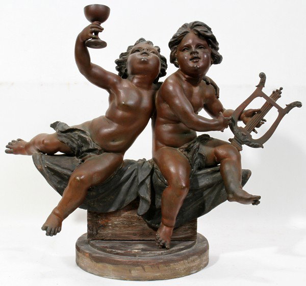 SPELTER SCULPTURE OF PUTTI, EARLY 20TH C., : SPELTER SCULPTURE OF PUTTI, EARLY 20TH C., H 16", W 22":A cherubic boy with chalice and cherubic girl with lyre, or viol; bronze-like patina. Not marked.