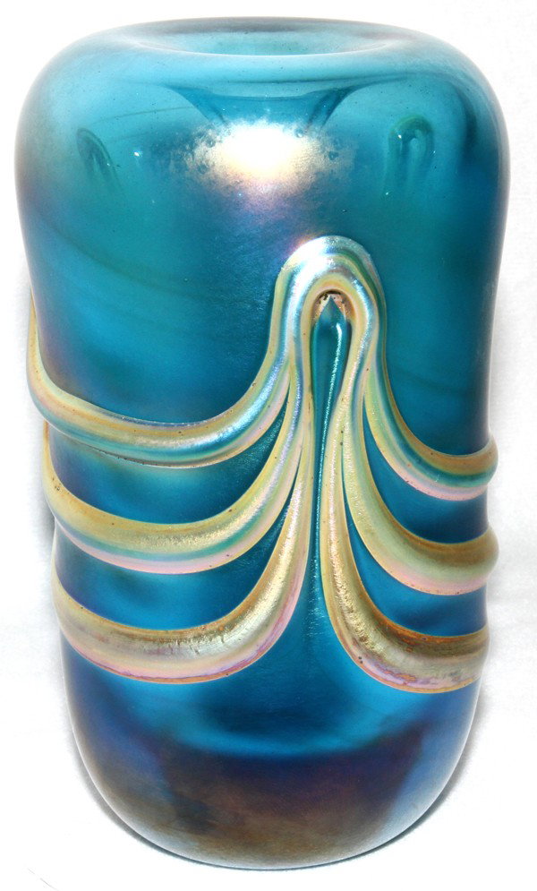 BRIAN LONSWAY IRIDESCENT BLUE GLASS VASE, 1975: BRIAN LONSWAY IRIDESCENT BLUE GLASS VASE, 1975, H 5":Iridescent blue glass vase with applied drapery motif; signed and dated "Brian Lonsway 1-75" at the underside. The Estate of George H. Gowen, Ottaw