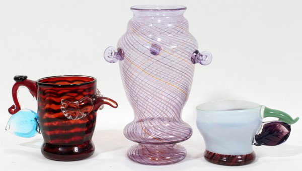 FRITZ DREISBACH, ART GLASS GROUPING, 3 PCS TOTA: FRITZ DREISBACH, ART GLASS GROUPING,, 3 PIECES TOTAL - 2 CUPS & 1 VASE, H 3" - 9", L 6" - 7":Leaf handle cup in milk, amethyst, green & brown, signed, H 3", L 6"; leaf and scroll cup, stripped amber, 