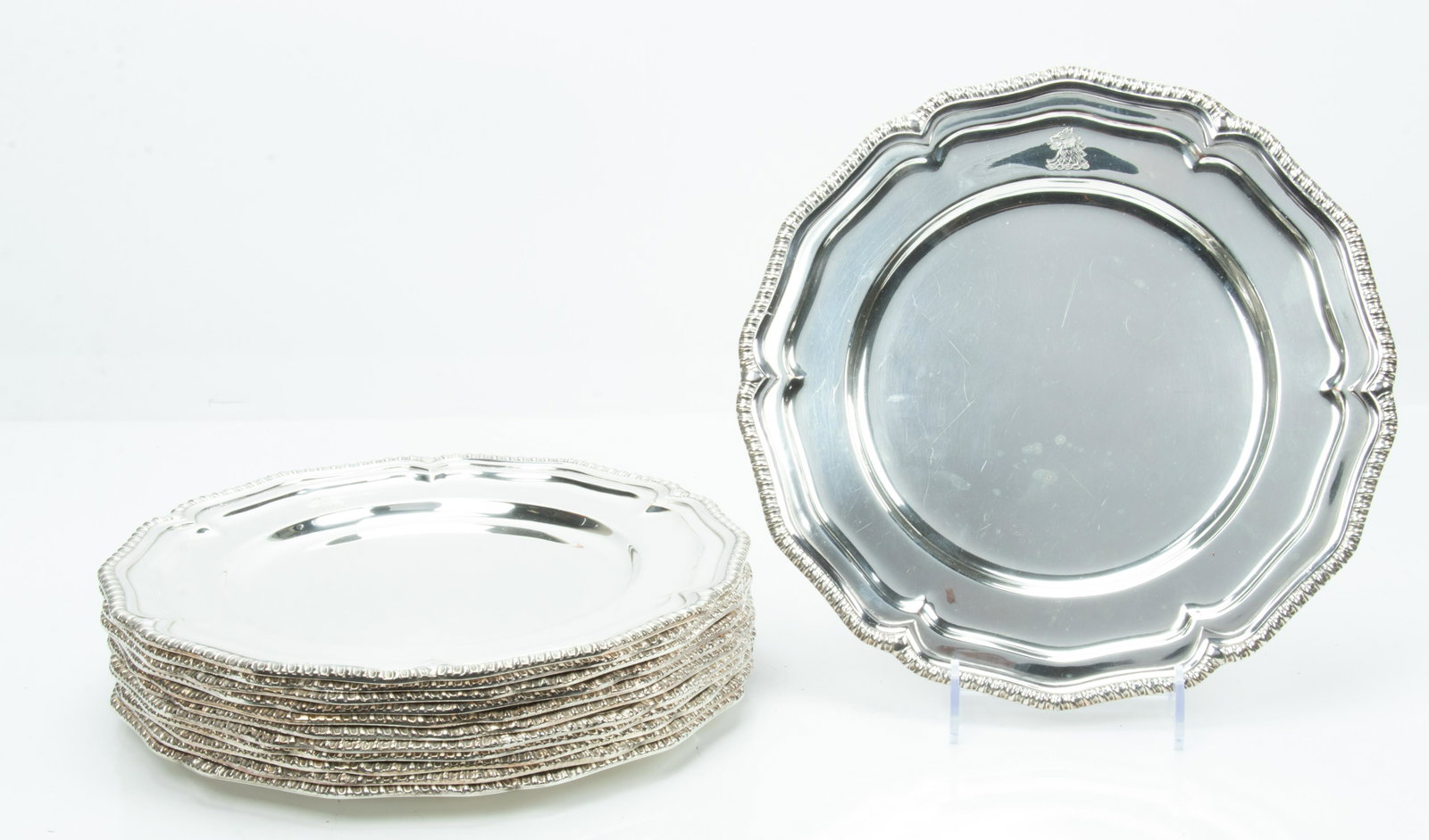 SHEFFIELD PLATE GADROON EDGE CHARGERS, SET OF 12, DIA 11", CRESTED: SHEFFIELD PLATE GADROON EDGE CHARGERS, SET OF 12, DIA 11", CRESTED Made in England. No monograms. Engraved crest.