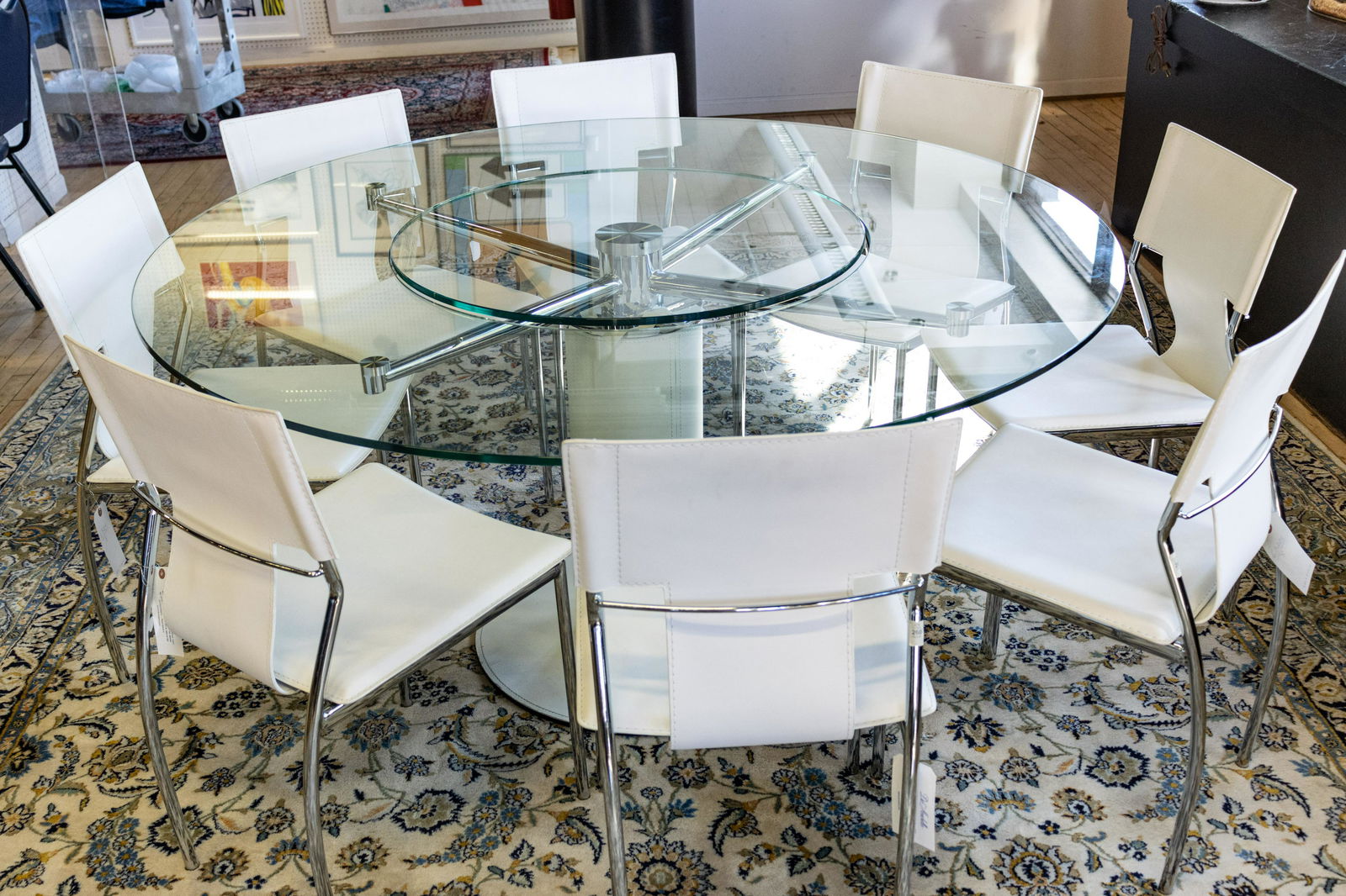 GLASS TOP TABLE AND 8 CHAIRS: GLASS TOP TABLE AND 8 CHAIRS Table: H 29.75", Dia 59". Chairs H 32.75", W 17", D 19".