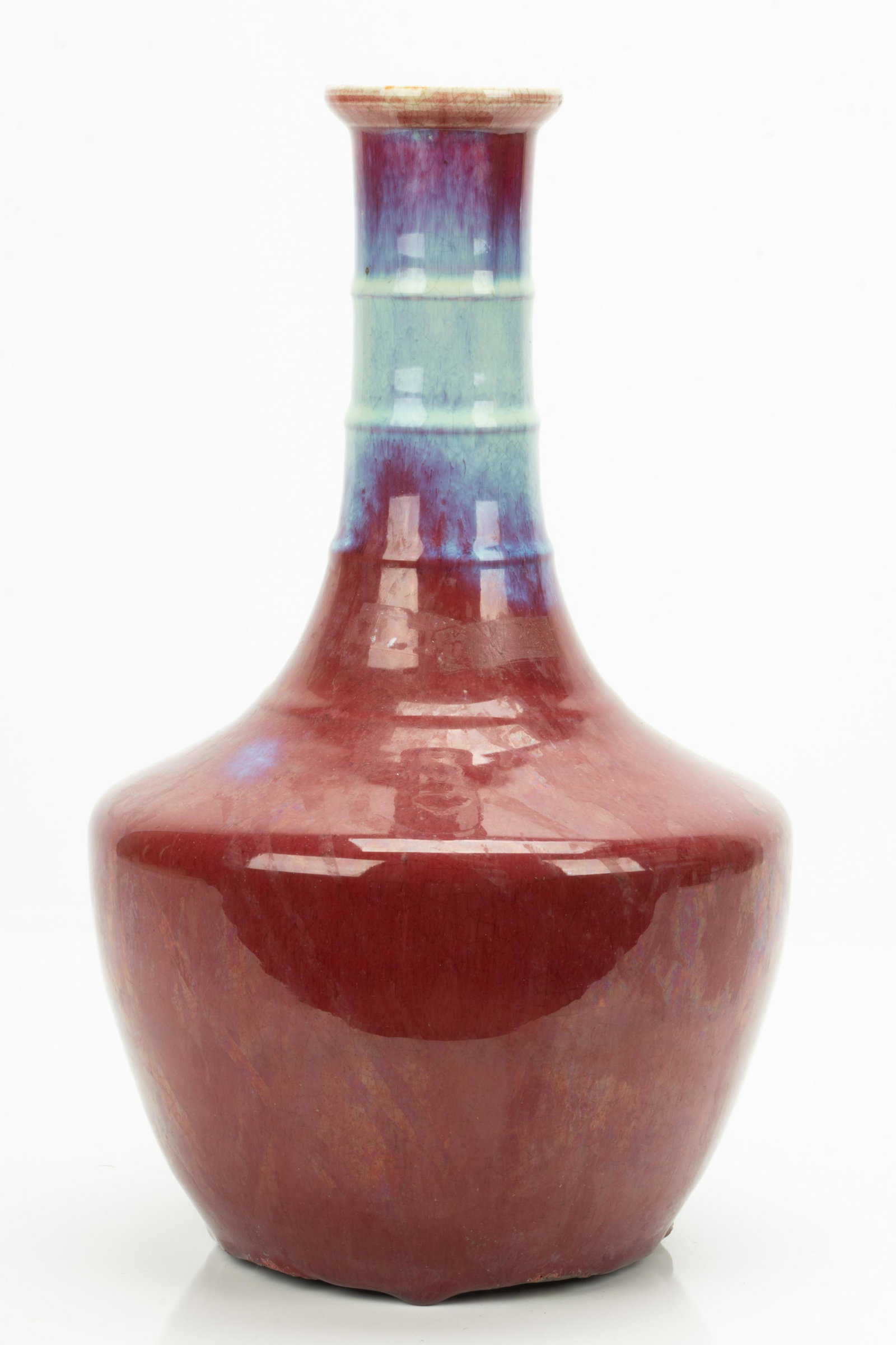 CHINESE SANG DE BOEUF PORCELAIN VASE, H 14", DIA 8": CHINESE SANG DE BOEUF PORCELAIN VASE, H 14", DIA 8" A Chinese sang de boeuf porcelain vase. Offers a ribbed neck and tapering bodice.