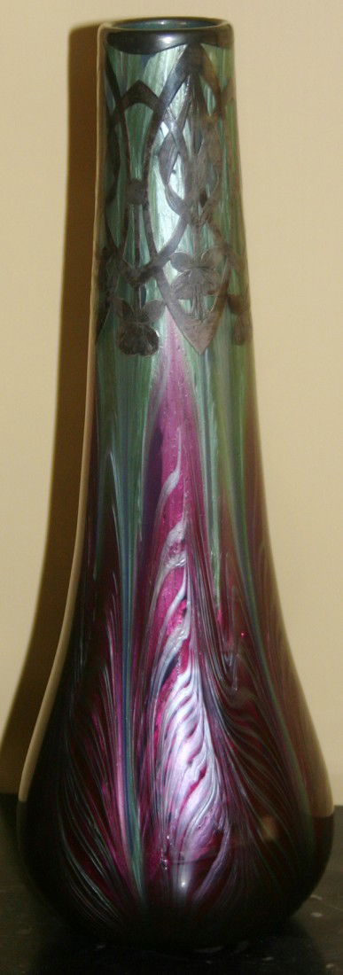 LOETZ ART GLASS VASE WITH STERLING OVERLAY,: LOETZ ART GLASS VASE WITH STERLING OVERLAY, H 11":With sterling silver overlay; teal and cranberry swirl design.