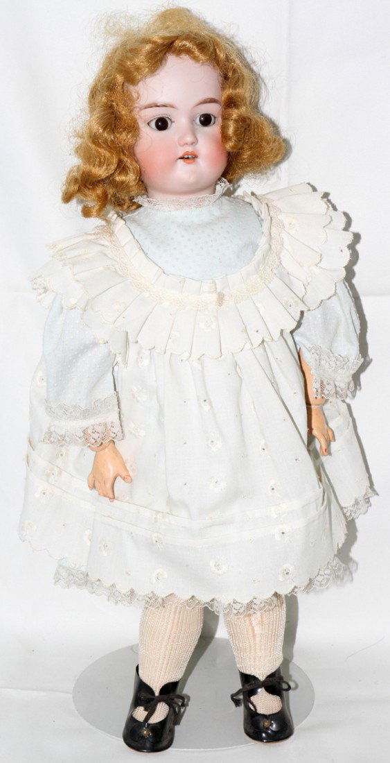 CUNO & OTTO DRESSEL BISQUE HEAD DOLL, H 19": CUNO & OTTO DRESSEL BISQUE HEAD DOLL, H 19":Bisque head doll with composition jointed body, sleep eyes and open mouth with two teeth. "Holz-masse" trademark on back.