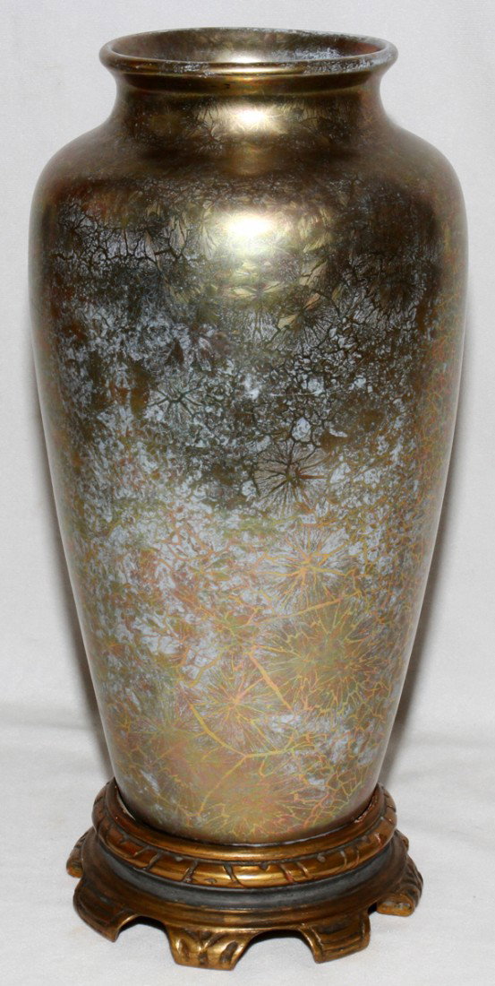 HENRY MARMORSTEIN ART POTTERY VASE, C. 1920, : HENRY MARMORSTEIN ART POTTERY VASE, C. 1920, H 13 1/4", DIA 6 1/2":Round with tapering sides iridescent floral pattern overall. Signed "Mamor 36/6 (last number is missing)" on the underside.