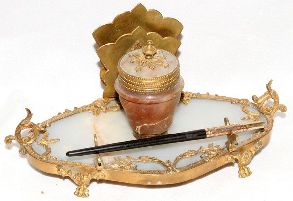 FRENCH ONYX INKSTAND, EARLY 20TH C., L 8 1/2": FRENCH ONYX INKSTAND, EARLY 20TH C., L 8 1/2":And onyx base centered by and onyx ink pot opening to porcelain liner with gilt metal mounts and letter holder together with 1 fountain pen.