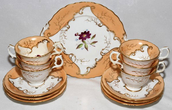 ENGLISH PORCELAIN TEA WARE, 19TH C., 13 PIECES: ENGLISH PORCELAIN TEA WARE, 19TH C., 13 PIECES:Including 6 tea cups (two with repaired handles) with 6 saucers (one with a 1 1/2" crack) and 1 cake plate, W.9 1/4"; all are uniquely hand painted at th