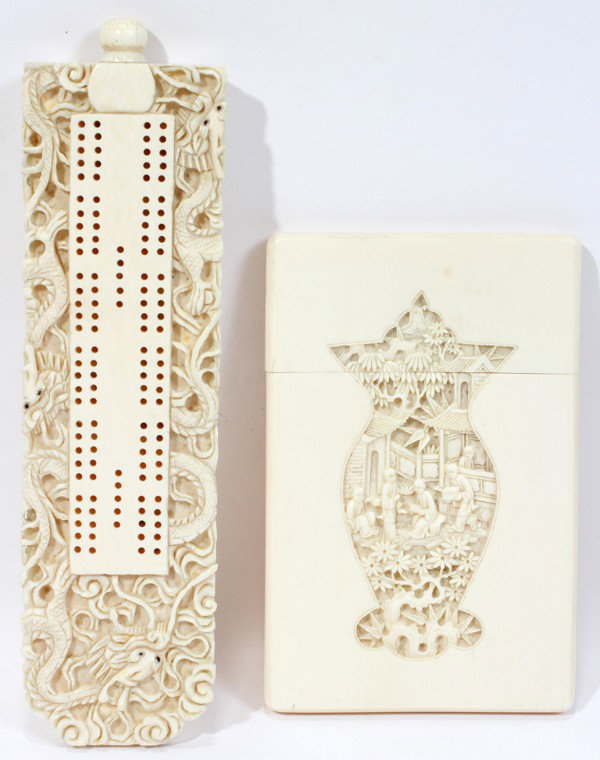 CHINESE IVORY CRIBBAGE BOARD & CARD CASE: CHINESE IVORY CRIBBAGE BOARD & CARD CASE, L 6 1/2" & 4 3/8":Including 1 cribbage board carved in relief with dragons, end unscrews to playing pieces, L.6 1/2"; and 1 rectangular calling card case with