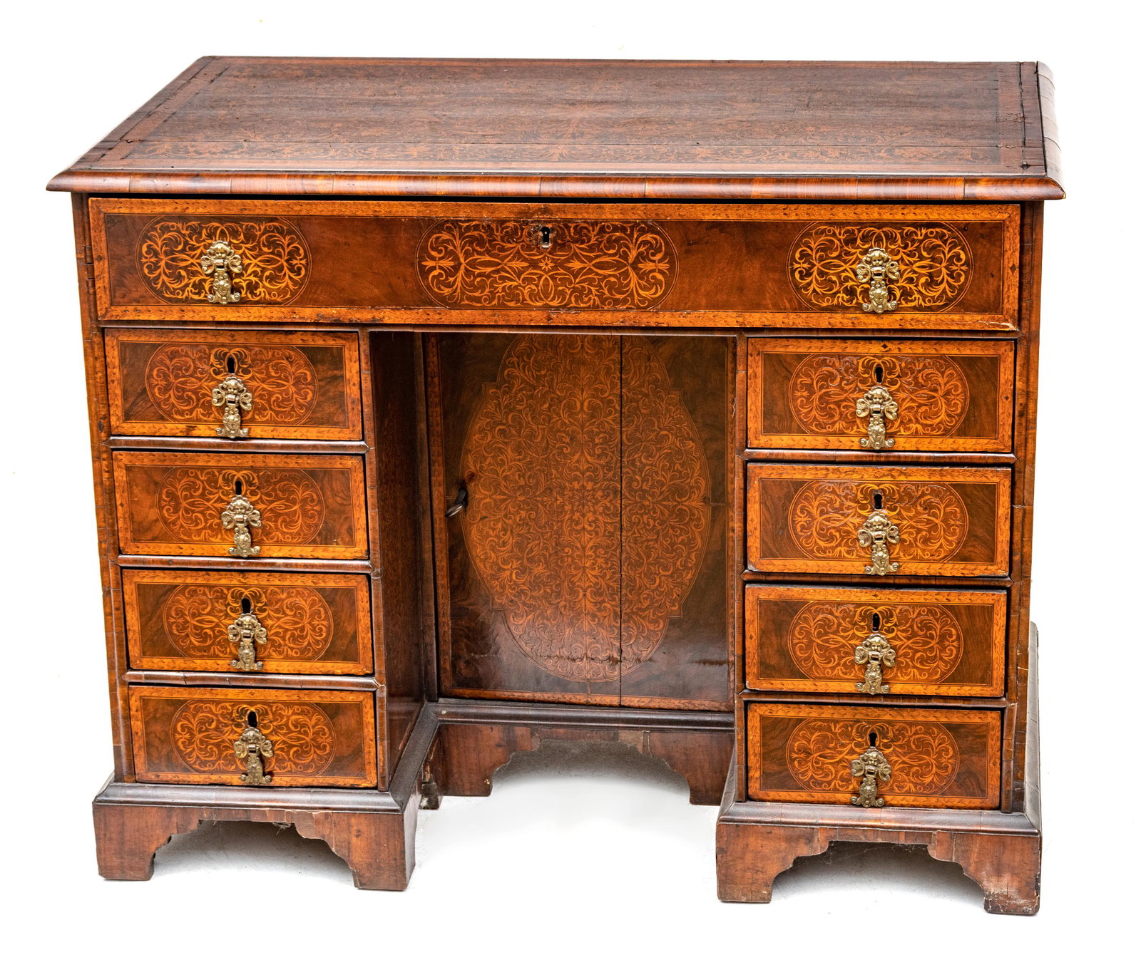 George Iii Style, English Walnut Inlay Knee Hole Desk, 18th C., H 31”, W 39”, L 23”: GEORGE III STYLE, ENGLISH WALNUT INLAY KNEE HOLE DESK, 18TH C., H 31", W 39", L 23" Having 1 long frieze drawer, and eight small drawers, all with brass pulls. Marquetry. Provenance: Property of a Roc