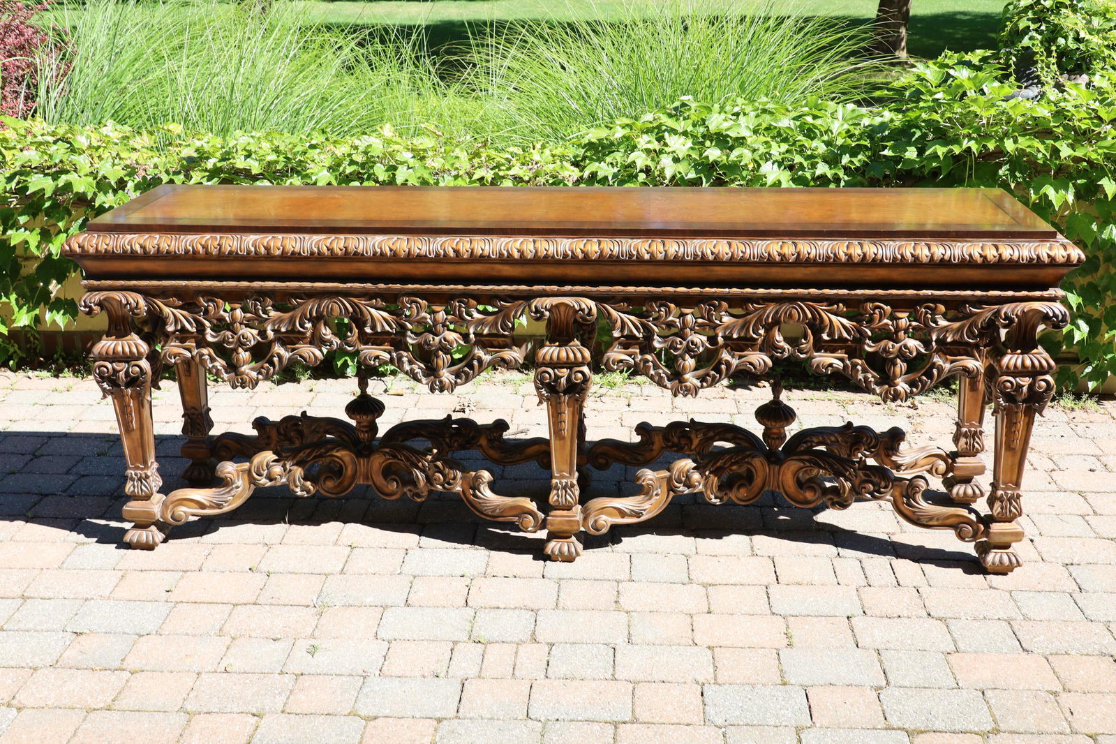 Renaissance Revival Carved Console Table, H 35’’ L 96’’ Depth 22’: Renaissance Revival Carved Console Table, H 35'' L 96'' Depth 22'' Mansion size. Elaborately pierced carved apron, paneled straight tapering legs, supported by two "X" form stretchers. Top surface is 