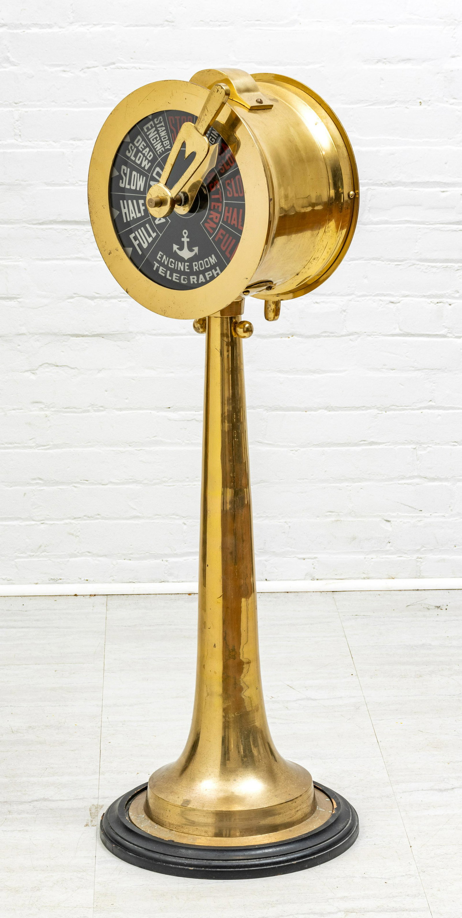 Brass Ship’s Engine Order Telegraph, H 44”, Dia 16”: BRASS SHIP'S ENGINE ORDER TELEGRAPH, H 44", DIA 16" A vintage brass ship's engine order telegraph. Offers two dial faces on each side with a brass lever and bell tone. 20th century.