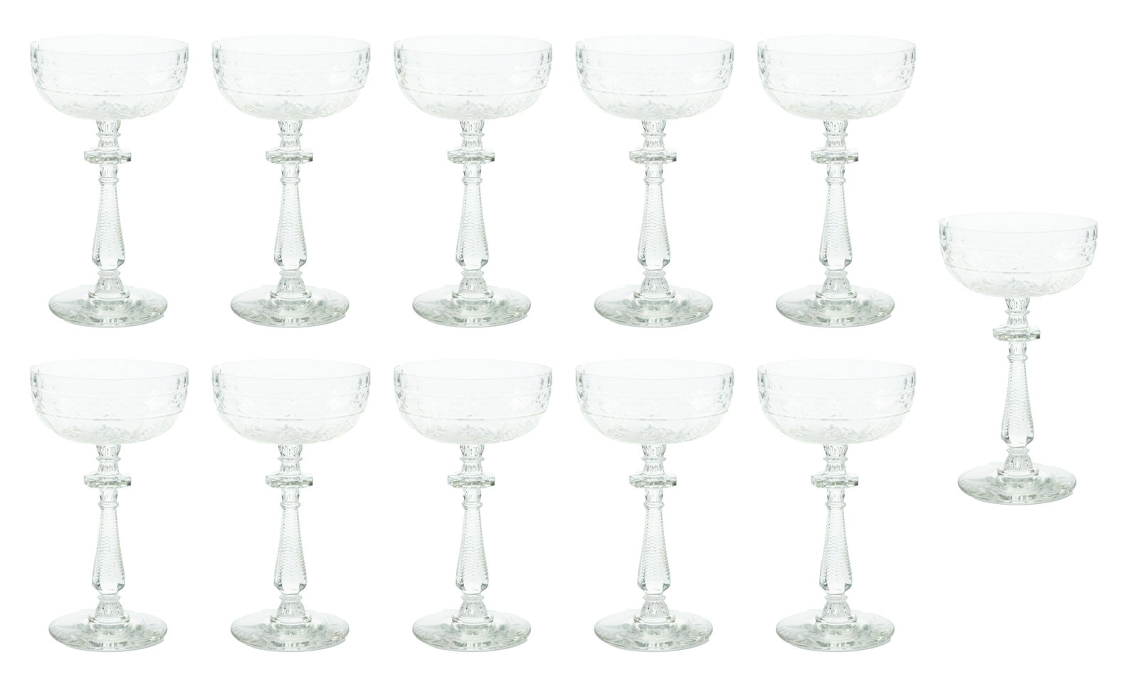 Cut and Etched Crystal Stem Champagnes Circa 1940, Set of 11: CUT AND ETCHED CRYSTAL STEM CHAMPAGNES CIRCA 1940, SET OF 11 Finely hand cut in flower and leaf motif. Knotched stems.