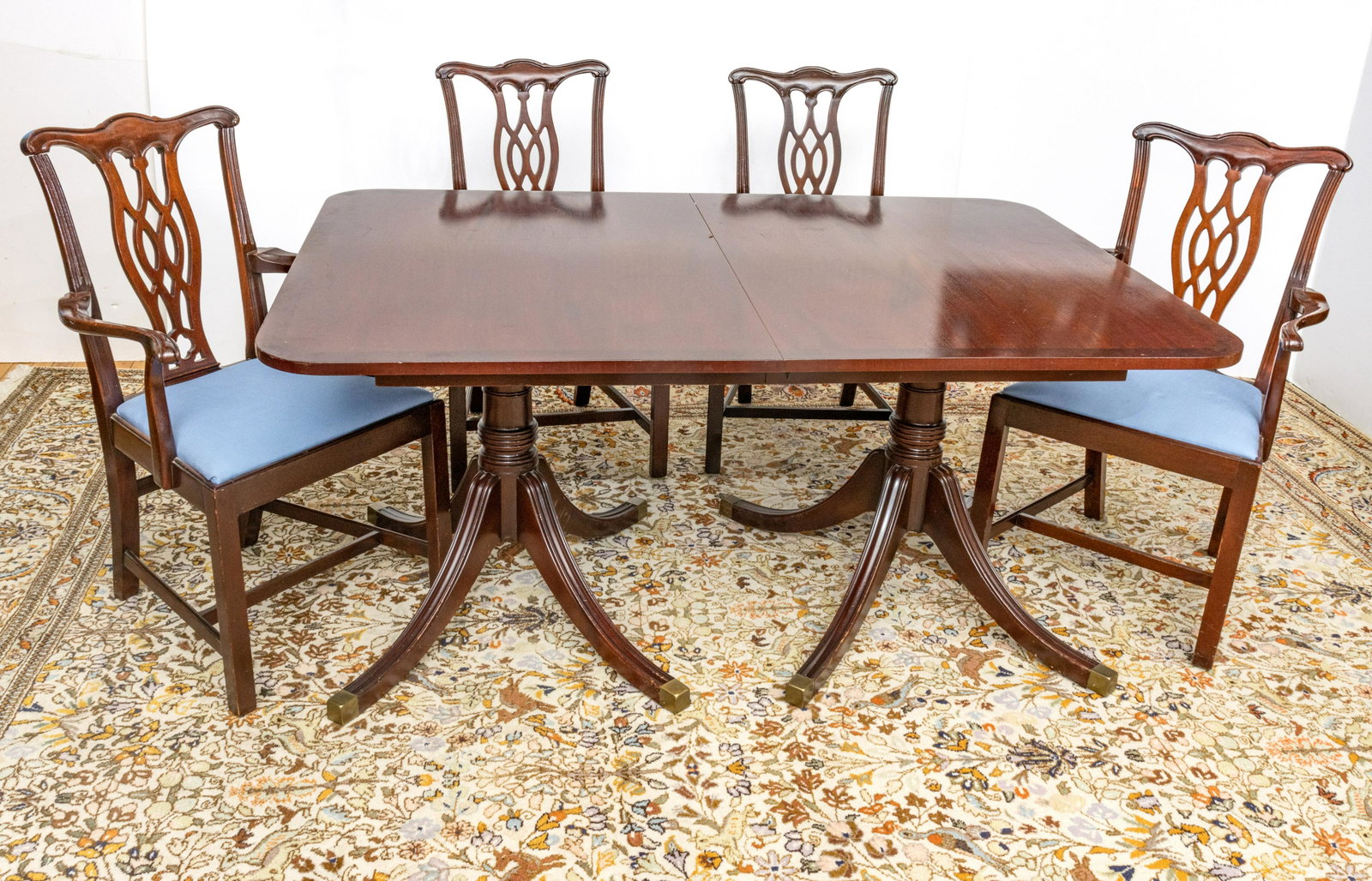 Mahogany Dining Table and Eight Chairs, 20th C., H 30”, W 44”, L 64” (Table): MAHOGANY DINING TABLE AND EIGHT CHAIRS, 20TH C., H 30", W 44", L 64" (TABLE) Pedestal base mahogany dining table with two 16" leaves. Two armchairs, H 38.25", W 21.5", D 19". Six side chairs, H 38.25"
