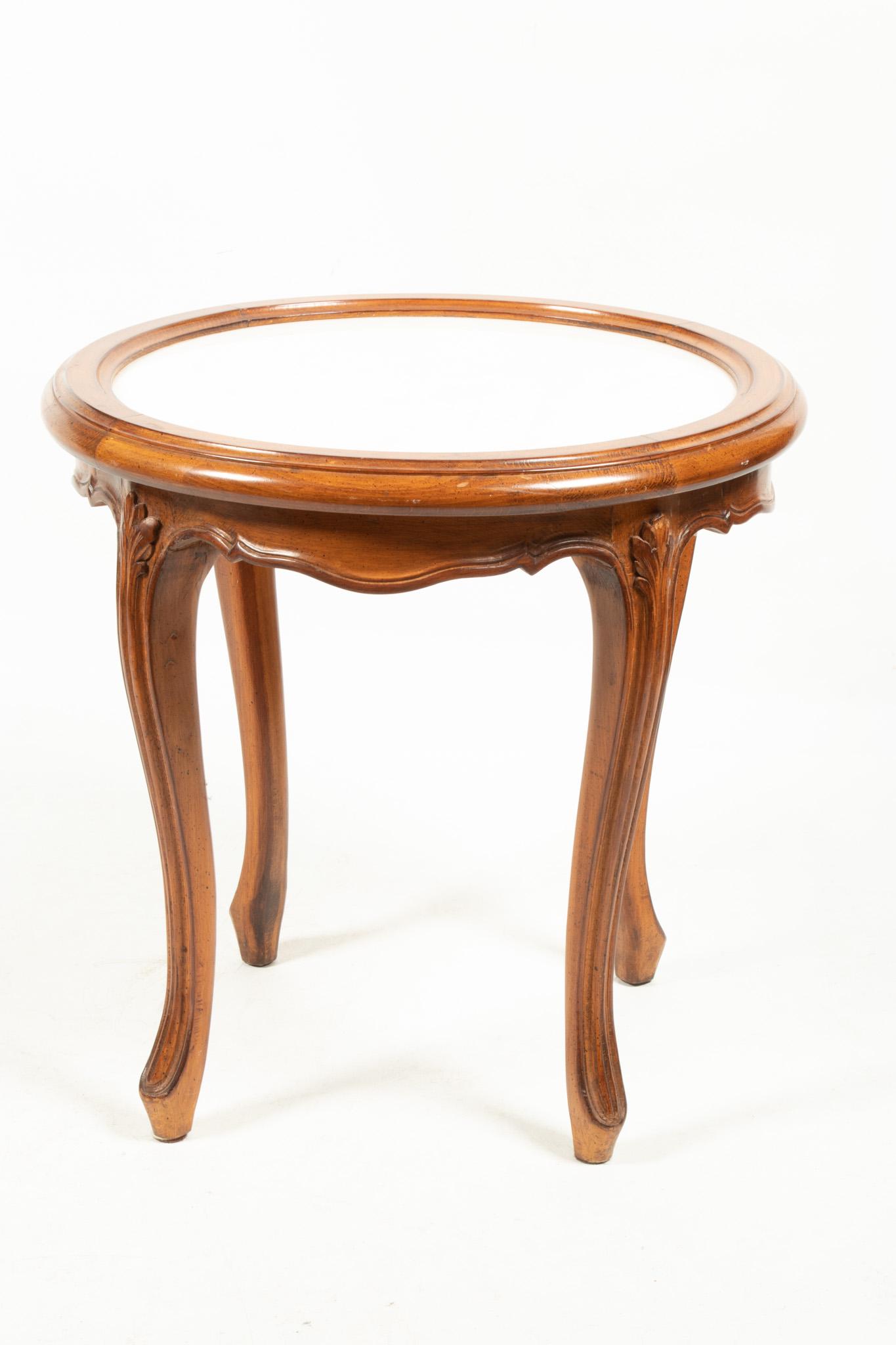 Italian Walnut Round Table, Marble Top C. 1950, H 20’’ Dia. 20’’: Italian Walnut Round Table, Marble Top C. 1950, H 20'' Dia. 20'' Hand carved, inset white marble. Provenance: property from a Grosse Pointe Farms second generation collection.
