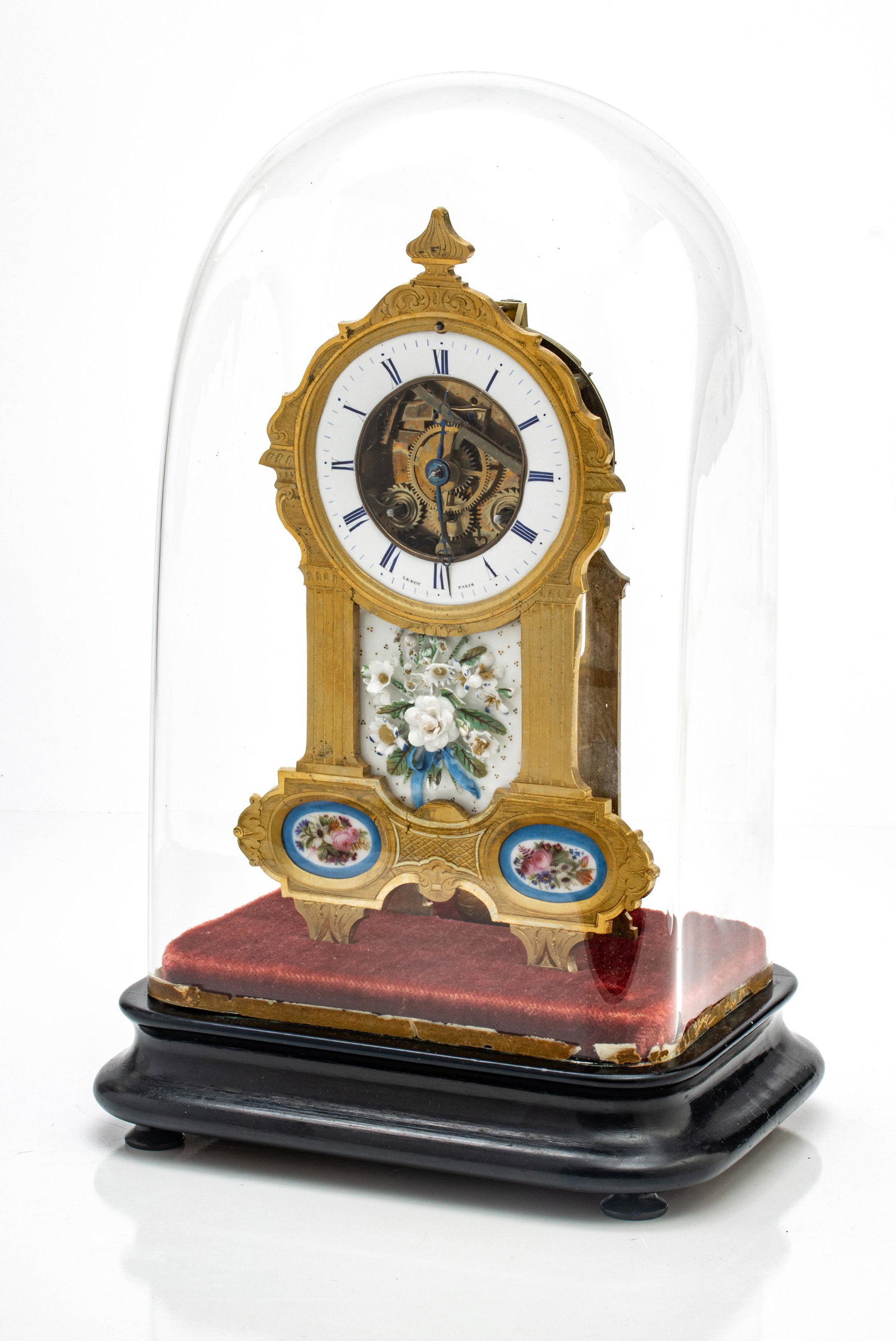 Leroy a Paris Dore Bronze and Painted Porcelain Clock, 19th C., H 9.5”, W 6”, D: LEROY A PARIS DORE BRONZE AND PAINTED PORCELAIN CLOCK, 19TH C., H 9.5", W 6", D 2.5" (CLOCK ONLY) Having an enamel clock face and dore bronze case. Two floral painted Sevres porcelain plaques in the l