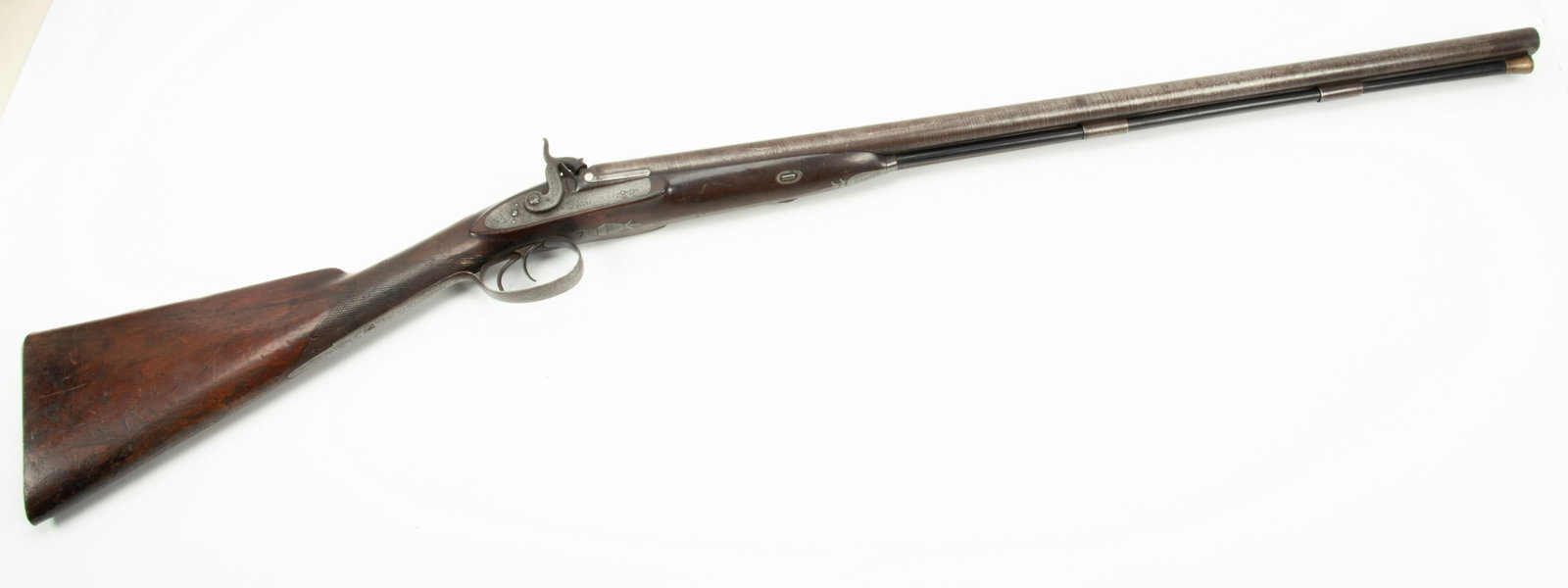 Westley Richards English Side by Side Double Barrel Percussion Cap Shotgun, 10 GA., Mid 19th C., L: WESTLEY RICHARDS ENGLISH SIDE BY SIDE DOUBLE BARREL PERCUSSION CAP SHOTGUN, 10 GA., MID 19TH C., L 30" BARREL, SN 1548 Walnut stock with checkered grip and Damascus barrel. Double hammers and triggers