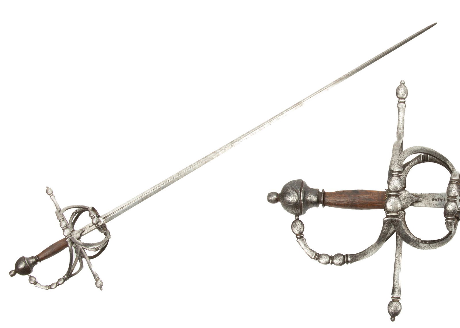 Pietro Caino (Milan) Composite Rapier, C. Late 16th/Early 17th C., L 51” (Total): PIETRO CAINO (MILAN) COMPOSITE RAPIER, C. LATE 16TH/EARLY 17TH C., L 51" (TOTAL) Having a floral engraved basket hilt with a wooden grip. Blade marked 'Caino' with an S under a crown on both sides of 
