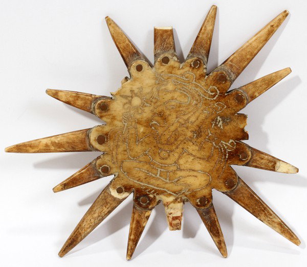 MAYAN SUN ARTIFACT, BONE, PRE 1850, DIA 7": MAYAN SUN ARTIFACT, BONE, PRE 1850, DIA 7":carved bone artifact in the shape of the sun with carved Mayan deities on each side with sunrays emanating from the carved figures; includes a signed certifi
