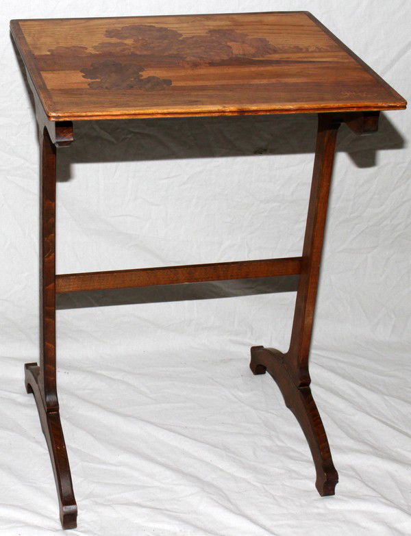 GALLE STYLE WOOD TABLES, TWO, H 27" & 28",: GALLE STYLE WOOD TABLES, TWO, H 27" & 28", W 15" & 19":27" H x 19" W x 15" D and 28" H x 23" W x 15" D; Inlaid 'Galle' name along with landscape scenes; trestle legs;