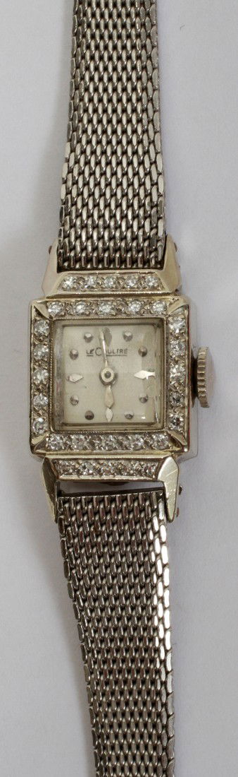 LE COULTRE W/GOLD & DIAMOND LADY'S WRISTWATCH: LE COULTRE WHITE GOLD & DIAMOND LADY'S WRISTWATCH:14 kt white gold watch inscribed on back and 1956. Dial is diamond enhanced. Band is speidel gold filled. L 7.5" From the Estate of Gloria Vuici - Smi