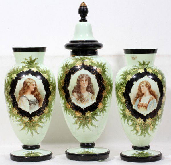 VICTORIAN BRISTOL GLASS PORTRAIT COVERED URN &: VICTORIAN BRISTOL GLASS PORTRAIT COVERED URN & PAIR OF VASES, LATE 19TH C., H 14"-20":A garniture set of 3 pieces including a covered urn, H.19 1/2", and pair of vases, H.14", each decorated at the fr
