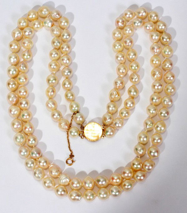 DOUBLE-STRAND BAROQUE PEARL NECKLACE, L 18": DOUBLE-STRAND BAROQUE PEARL NECKLACE, L 18":14kt plain gold clasp. 6 - 8 mm pearls. From the Estate of Gloria Vuici - Smith, Grosse Pointe, Mi.