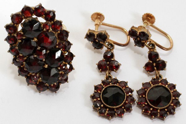 GARNET RING & PAIR OF GARNET DROP EARRINGS: GARNET RING & PAIR OF GARNET DROP EARRINGS:Antique, probably bohemian. "14 kt screw" on earrings. Ring is marked 14 ct RF. Three pieces total. From the Estate of Gloria Vuici - Smith, Grosse Pointe, M