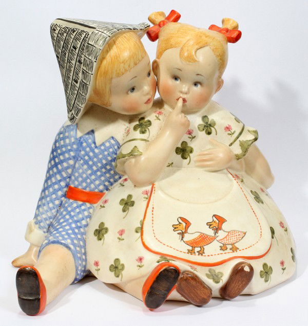 LENCI CERAMIC FIGURE GROUP OF CHILDREN, 1939,: LENCI CERAMIC FIGURE GROUP OF CHILDREN, 1939, H 6 1/2", W 8":A seated boy and girl, hand-painted, signed and dated 1939 at the underside (see additional photo), impressed 585, with remnants of origina