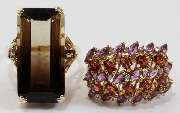 14 KT YELLOW GOLD, EMERALD CUT SMOKY TOPAZ RING: 14 KT YELLOW GOLD, EMERALD CUT SMOKY TOPAZ RING:Together with a 10 kt yellow gold, garnet, amethyst and white sapphire ring.