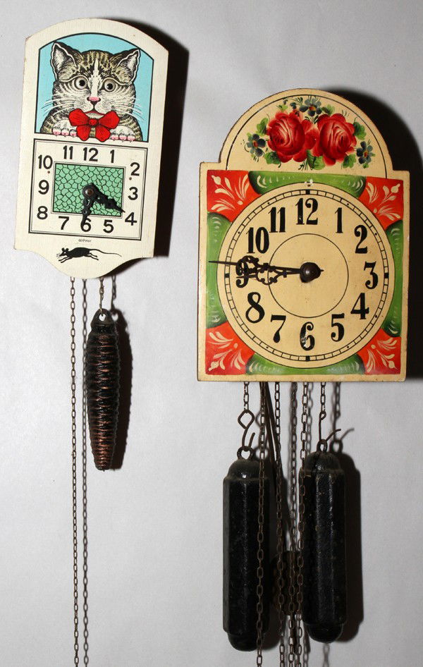 GERMAN & VICTORIAN WALL CLOCKS, 2, 7" X 4" &: GERMAN & VICTORIAN TRANSFER & ENAMELED WALL CLOCKS, TWO, 7" X 4" & 8" X 6":Including 1 German wall clock with the image of a cat on it, whose eyes move, with pendulum and weight together with 1 Victor