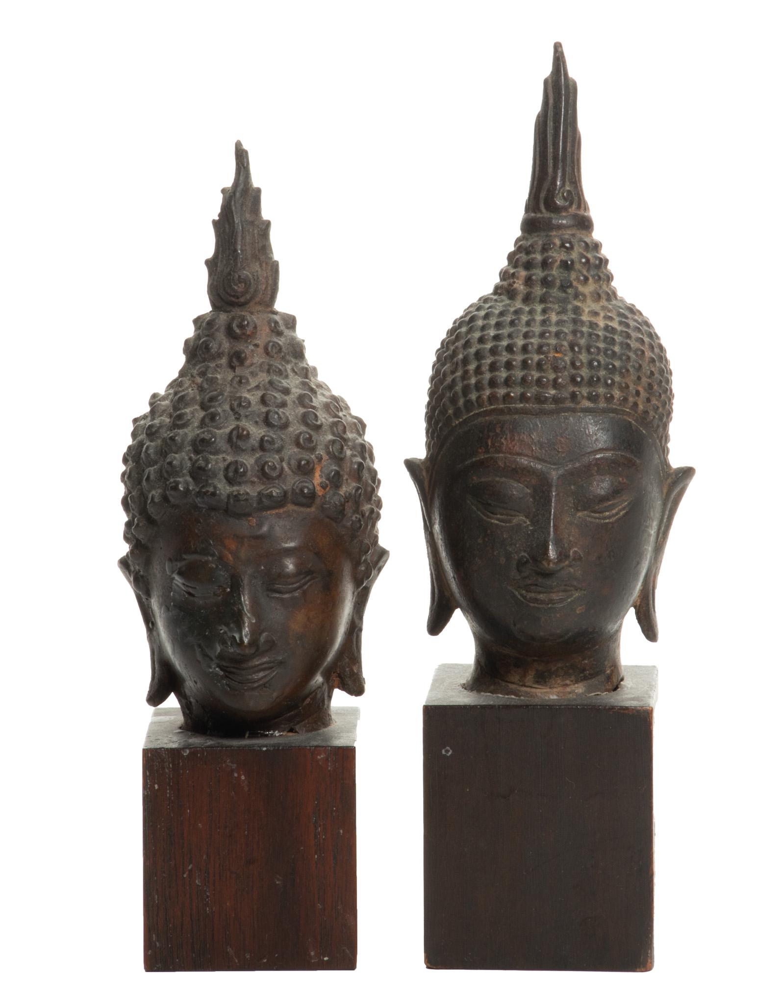 Southeast Asian Bronze Buddha Heads, H 6'' W 2.5'' 2 pcs: Southeast Asian Bronze Buddha Heads, H 6'' W 2.5'' 2 pcs A pair of Southeast Asian bronze Buddha heads, probably Thai. Depicting resting Buddha with closed eyes, symbolizing focused concentration and 