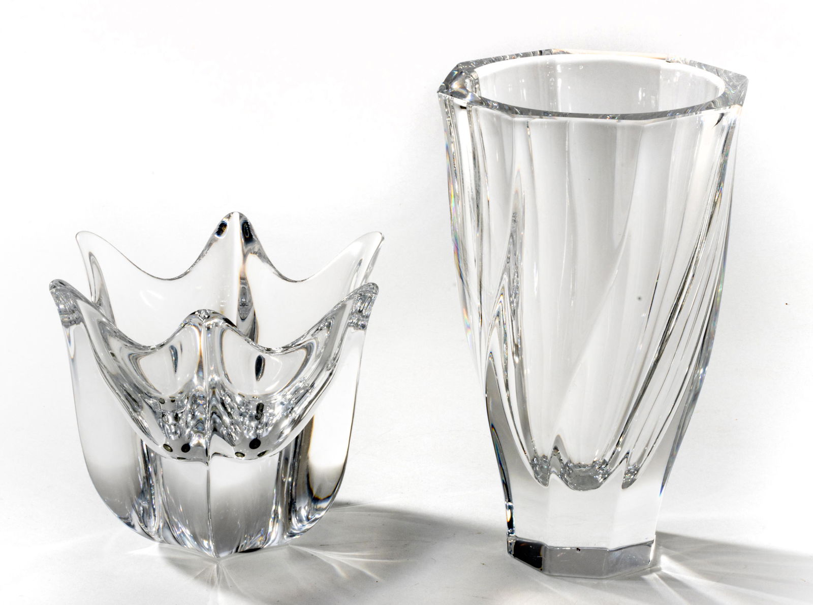 Orrefors Crystal Bowl & Vase, H 8'' Dia. 5.25'' 2 pcs: Orrefors Crystal Bowl & Vase, H 8'' Dia. 5.25'' 2 pcs A selection of two Orrefors crystal pieces. Includes a splash form bowl (H 4.75" x DIA 6") and a swirl form vase. Each bearing signature branding
