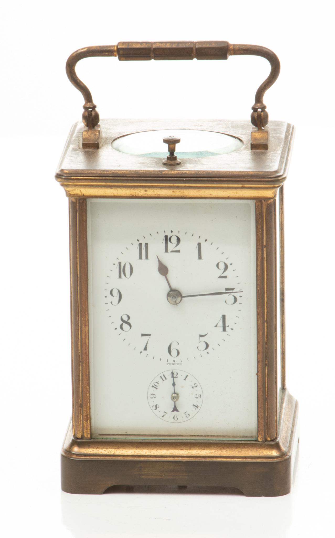 Couaillet Freres, French Brass Carriage Clock C. C 1900, H 6'' W 3'': Couaillet Freres, French Brass Carriage Clock C. C 1900, H 6'' W 3'' With key. Enamel dial. Signed on lower left back plate. Provenance: a Grosse Pointe Farms, MI second generation collection.