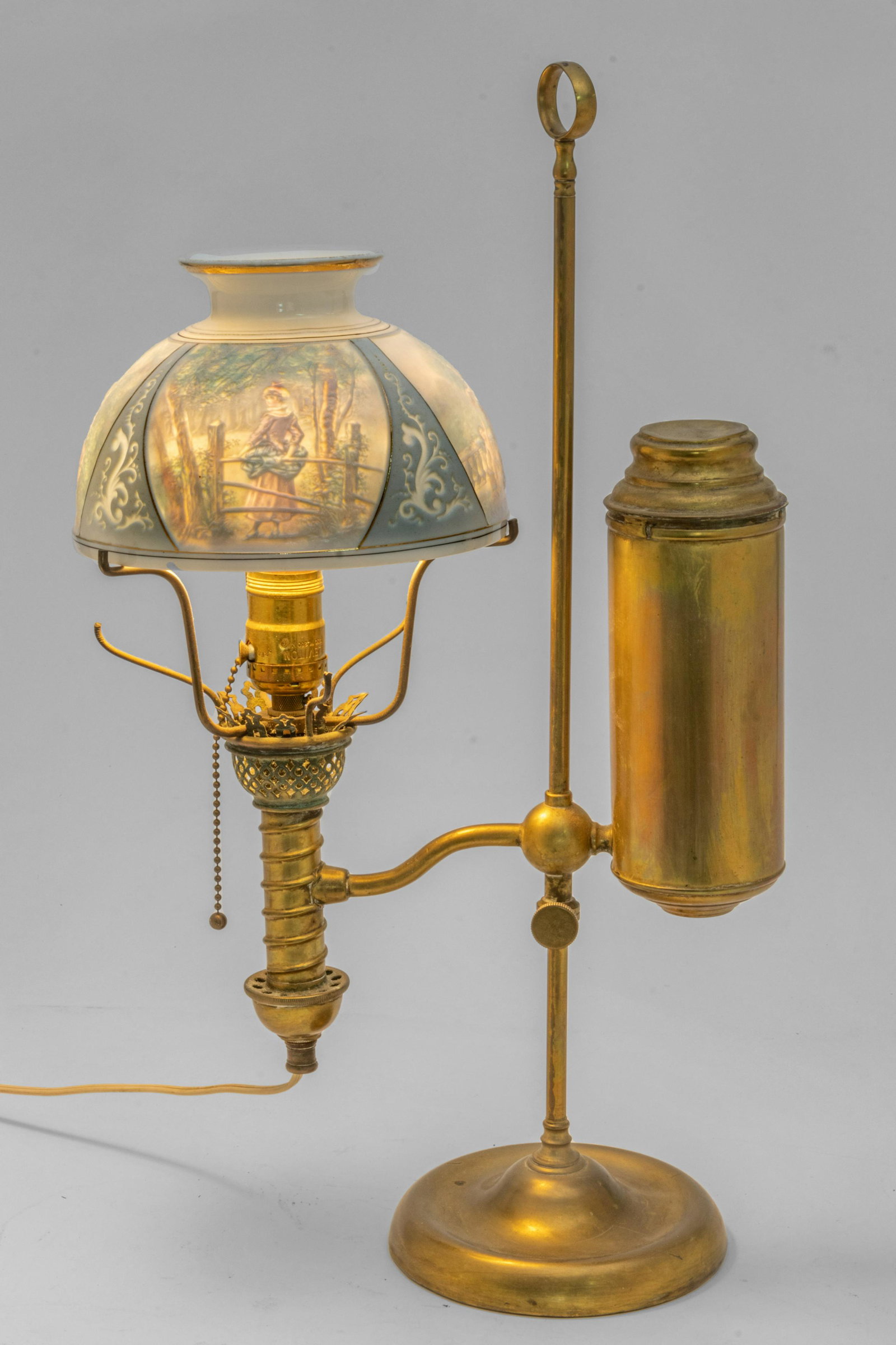 German Brass Counterweight Student Lamp, Lithopane Glass Shade H 20'': German Brass Counterweight Student Lamp, Lithopane Glass Shade H 20'' Lithopane glass stand with scenes. Dia. 7". Lamp brought from Germany circa 1920, however was made circa 1870 and since adapted to