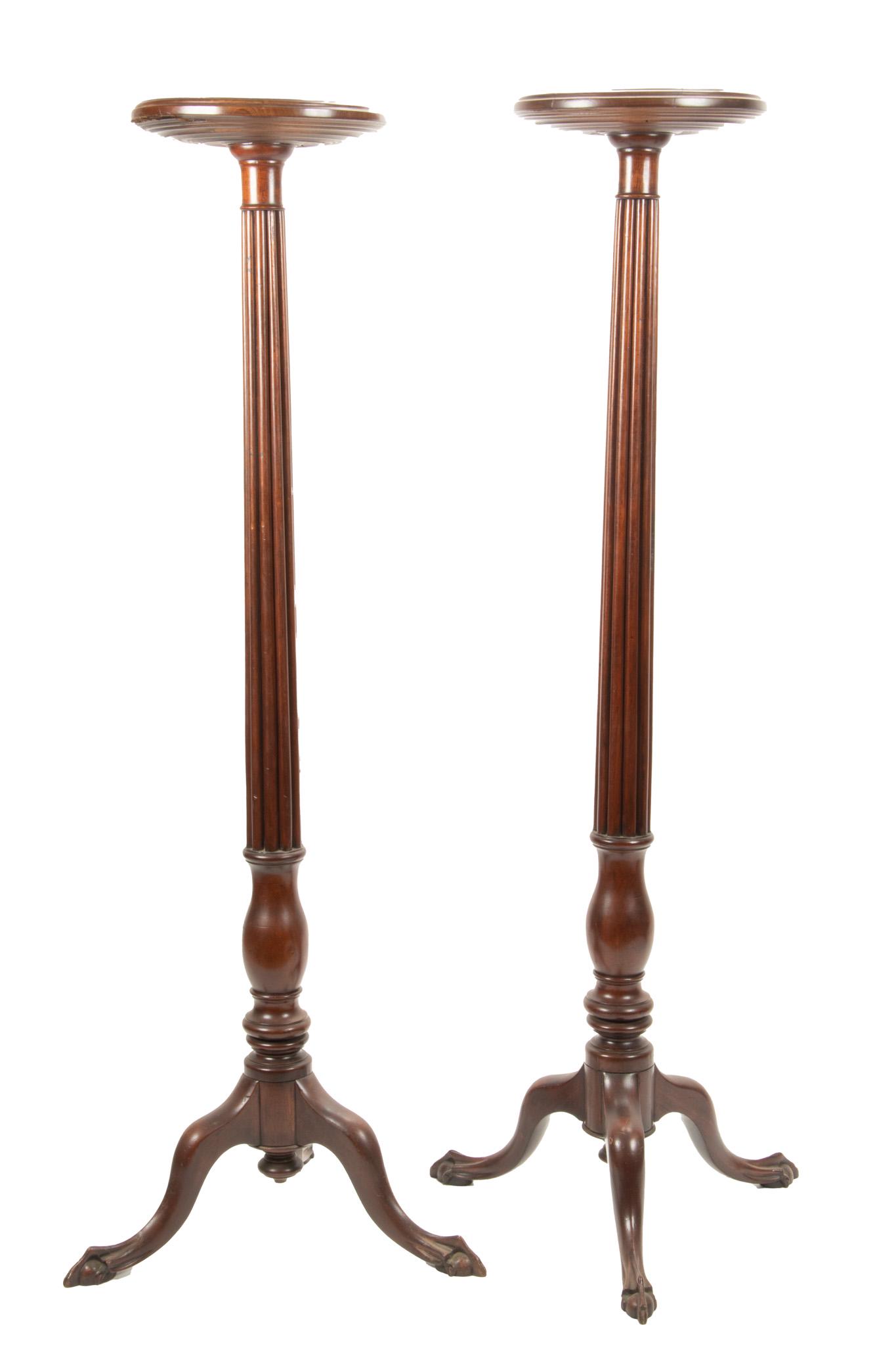 American Carved Wood Pedestals, H 58'' Dia. 13'': American Carved Wood Pedestals, H 58'' Dia. 13'' Having a reeded central columns, tripod legs with ball and claw feet.