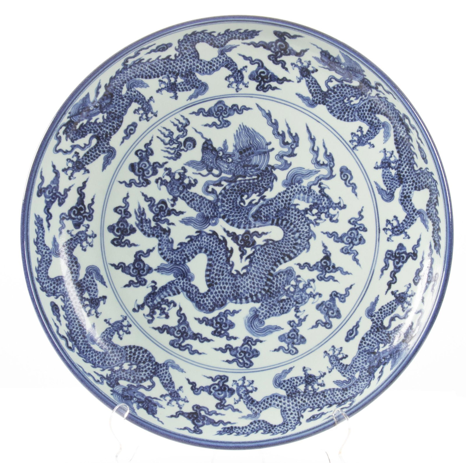 Chinese Blue & White Porcelain Charger, H 3.5'' Dia. 24.5'': Chinese Blue & White Porcelain Charger, H 3.5'' Dia. 24.5'' A Chinese blue and white porcelain charger. Offers a dragon and atmospheric motif to the basin. No artist's marks or calligraphic marks to t