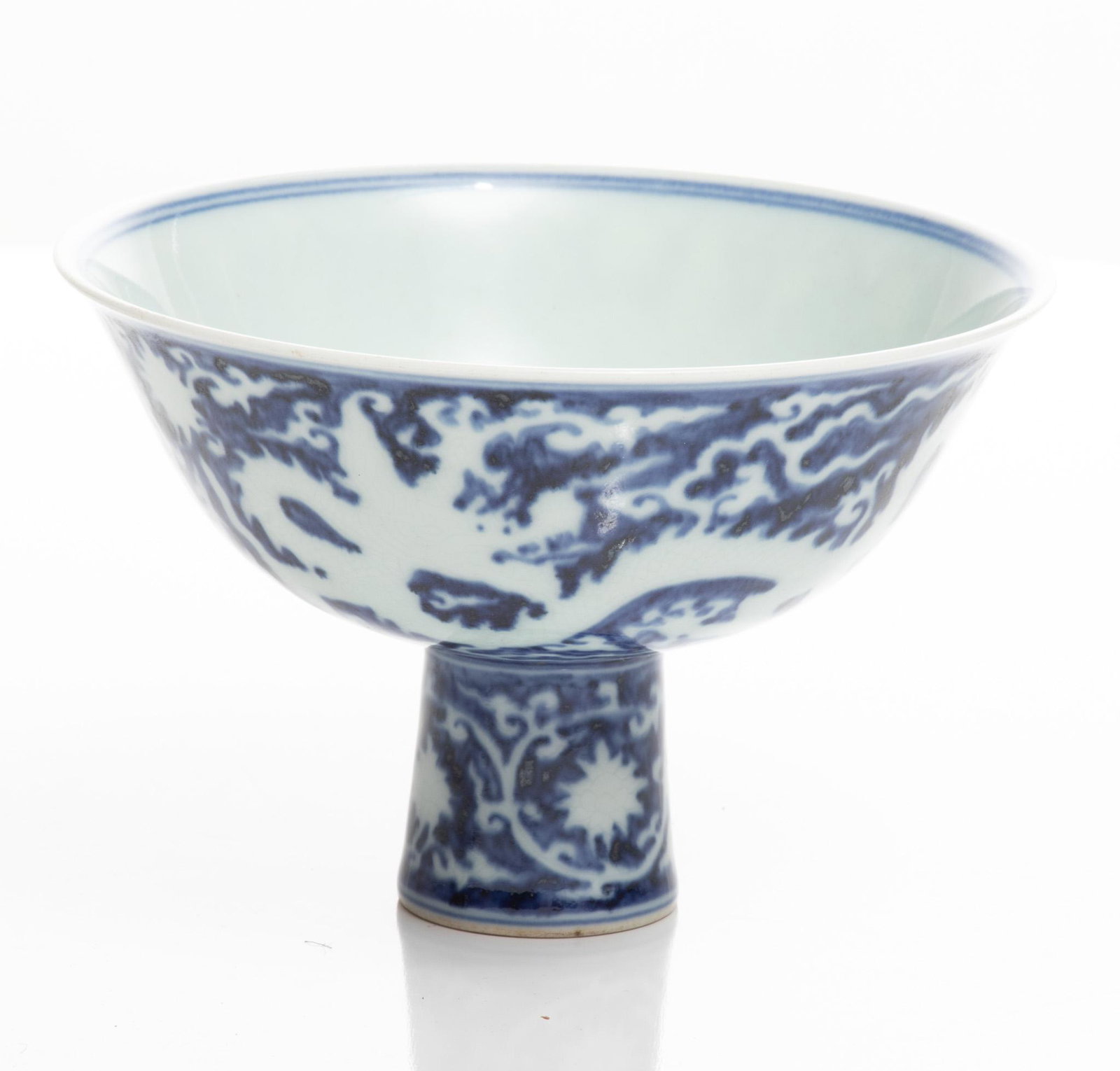 Chinese Blue And White Porcelain Stem Cup, H 4'' Dia. 6.25'': Chinese Blue And White Porcelain Stem Cup, H 4'' Dia. 6.25'' Blue and white porcelain decorated with dragons in silhouette. Character marks at the interior of the bowl.